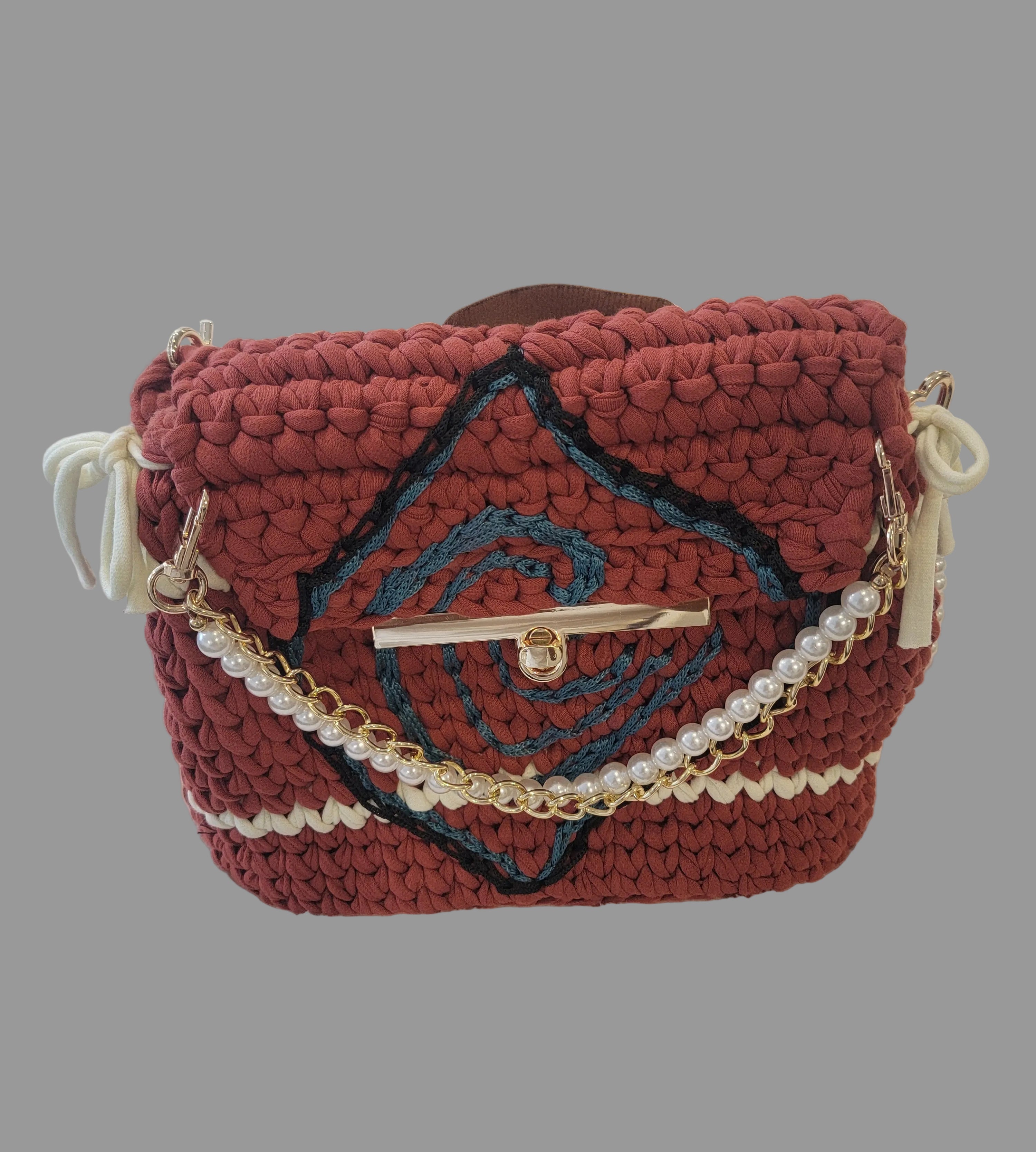 Backpack with embroidery and pearl chain